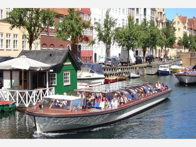 See Denmark's capital from a boat. 